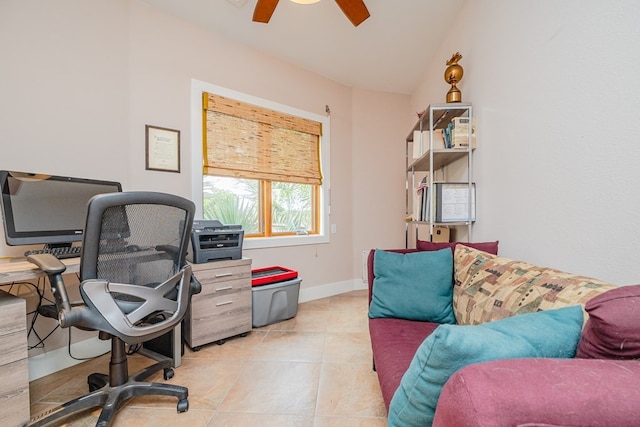 tiled home office with ceiling fan and vaulted ceiling