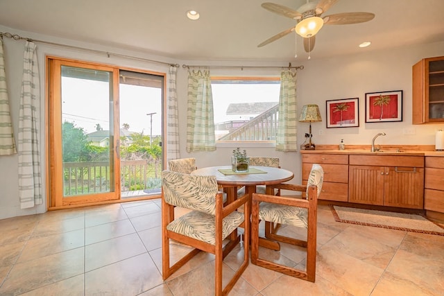 dining room with sink and ceiling fan