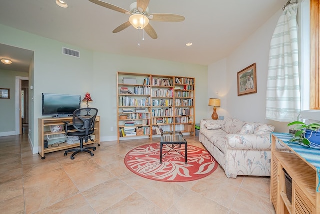 interior space featuring ceiling fan