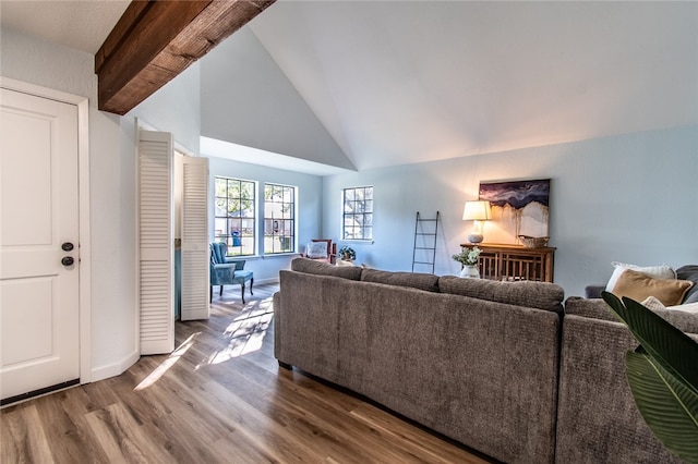 living room featuring high vaulted ceiling, dark wood-type flooring, and beamed ceiling