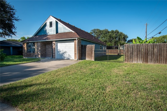 view of side of property with a garage and a yard