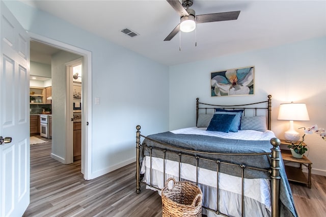 bedroom with wood-type flooring and ceiling fan