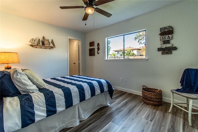 bedroom featuring hardwood / wood-style flooring and ceiling fan