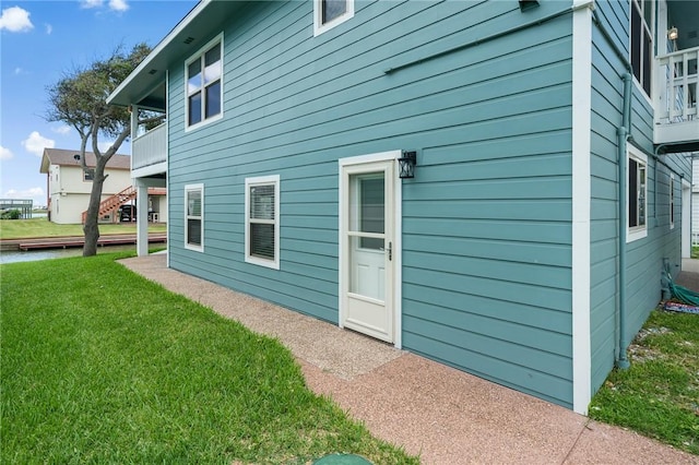 view of home's exterior with a yard