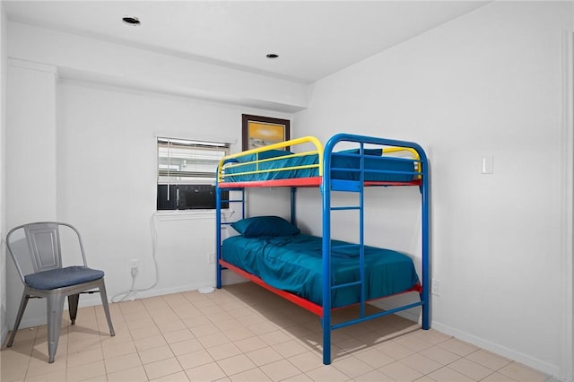 bedroom with light tile patterned floors