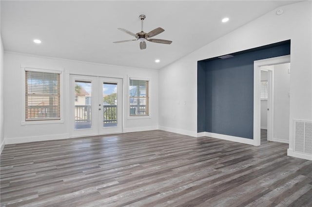 unfurnished living room with ceiling fan, french doors, hardwood / wood-style floors, and lofted ceiling