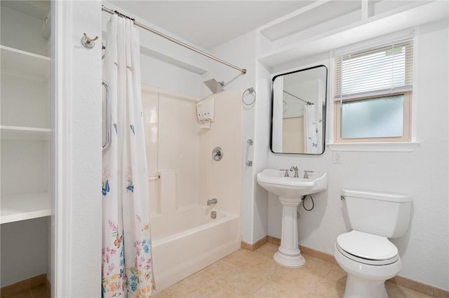 bathroom featuring tile patterned floors, toilet, and shower / tub combo with curtain