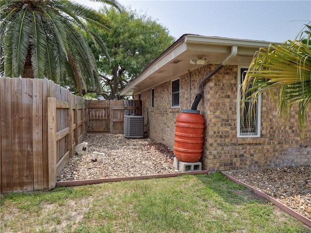 14350 Aquarius St, Corpus Christi, TX 78418 - view of side of property featuring central AC and brick siding