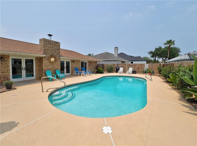 14350 Aquarius St, Corpus Christi, TX 78418 - view of pool with french doors, a patio area, and a fenced backyard