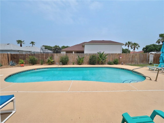 14350 Aquarius St, Corpus Christi, TX 78418 - view of swimming pool featuring a patio area and a fenced backyard