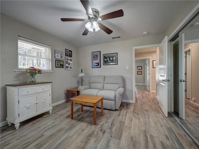 14350 Aquarius St, Corpus Christi, TX 78418 - living area featuring ceiling fan, light wood-style flooring, and baseboards