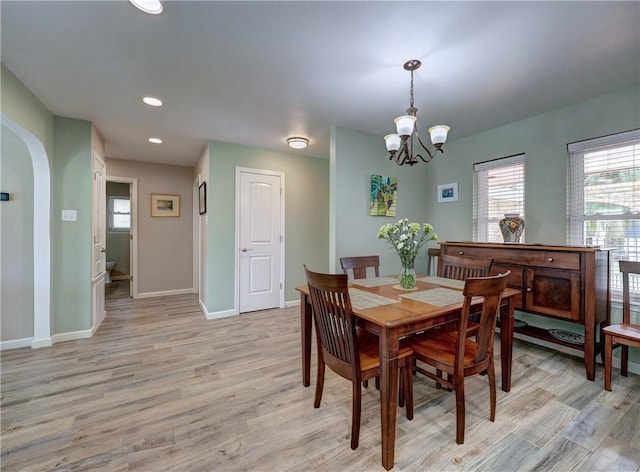 14350 Aquarius St, Corpus Christi, TX 78418 - dining space featuring light wood finished floors, baseboards, a chandelier, recessed lighting, and arched walkways