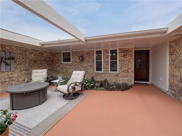 14350 Aquarius St, Corpus Christi, TX 78418 - view of patio with an outdoor fire pit