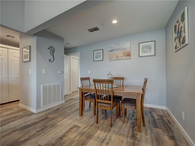 dining area featuring hardwood / wood-style flooring