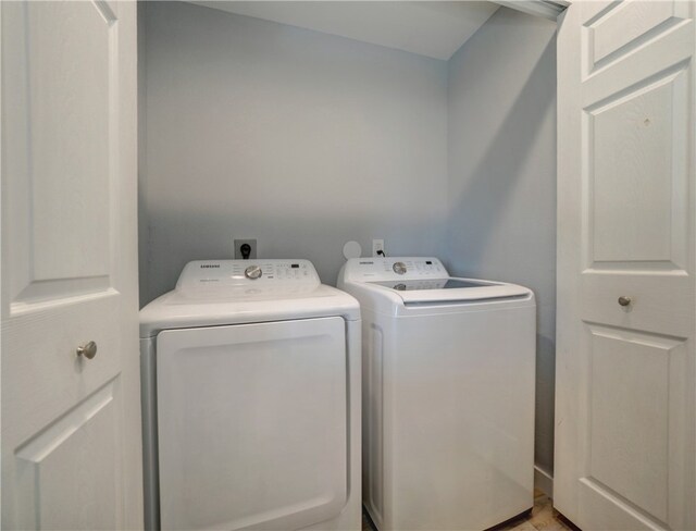 washroom with washer and dryer