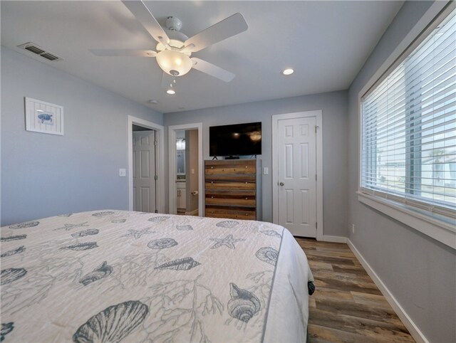 bedroom with dark wood-type flooring and ceiling fan