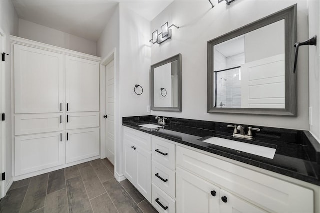 bathroom featuring vanity and walk in shower