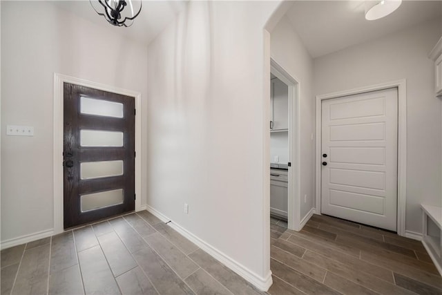 foyer entrance with an inviting chandelier