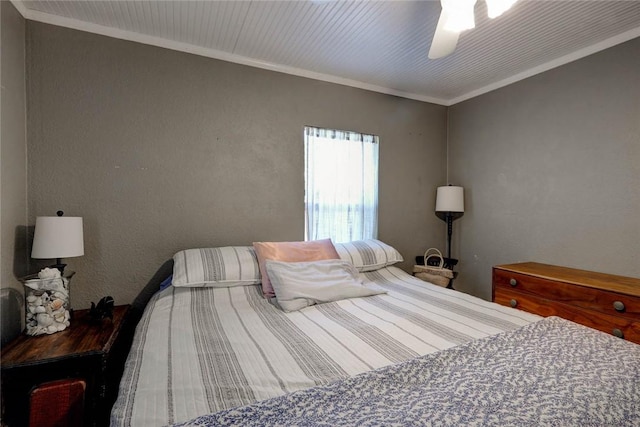 1820 16th St, Rockport, TX 78382 - bedroom featuring ornamental molding, ceiling fan, and a textured wall