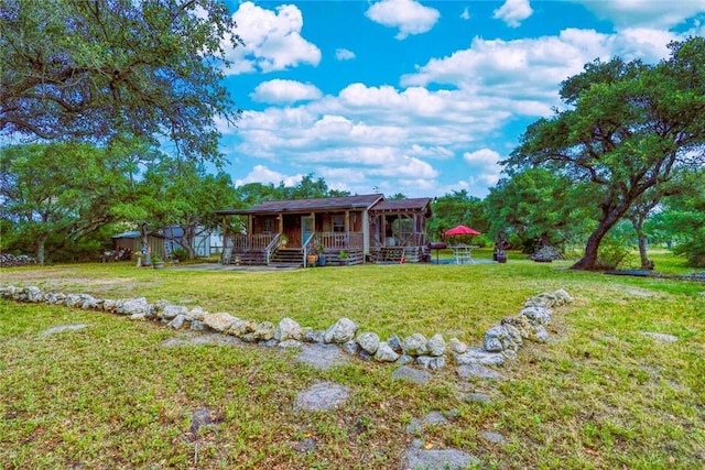 1820 16th St, Rockport, TX 78382 - exterior space with a porch and a lawn