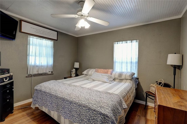 1820 16th St, Rockport, TX 78382 - bedroom with baseboards, crown molding, and wood finished floors
