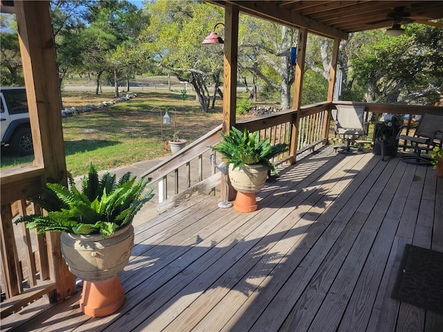 1820 16th St, Rockport, TX 78382 - wooden deck with ceiling fan and a lawn
