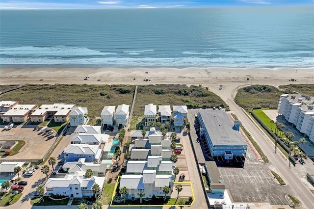 bird's eye view with a beach view and a water view