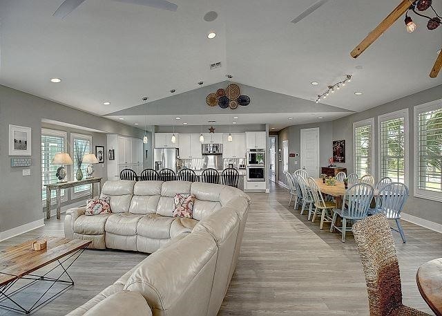 living room with lofted ceiling and light hardwood / wood-style flooring