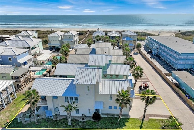 drone / aerial view with a view of the beach and a water view