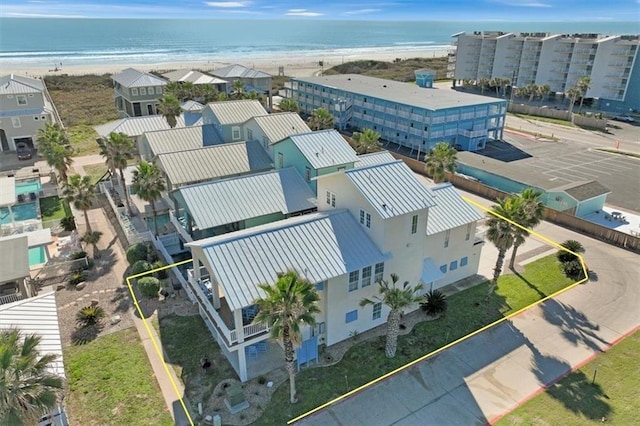 aerial view featuring a water view and a beach view