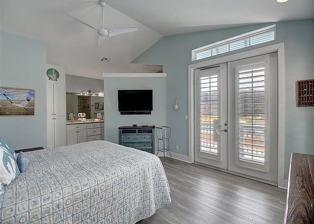 bedroom with ceiling fan, french doors, access to outside, and multiple windows