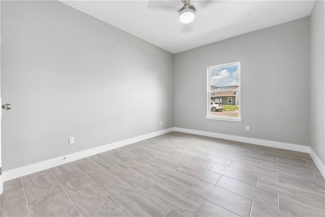 unfurnished room with ceiling fan