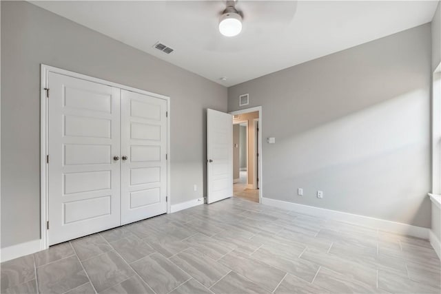 unfurnished bedroom with a closet and ceiling fan