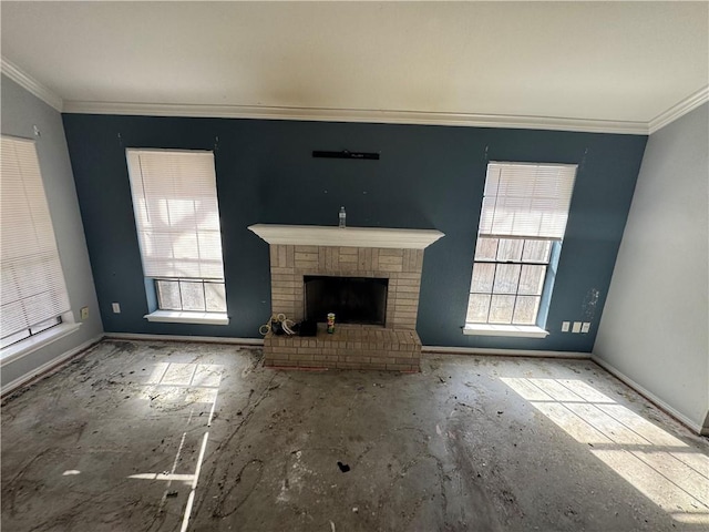 unfurnished living room with a fireplace, crown molding, and baseboards