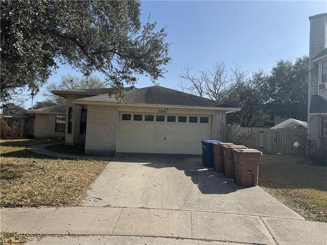 single story home featuring a garage, brick siding, concrete driveway, and fence