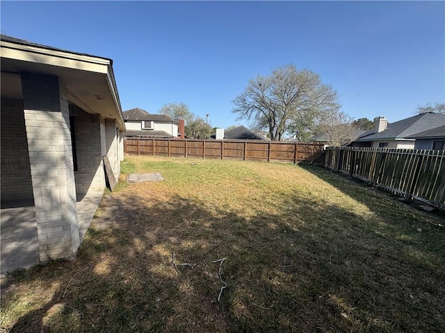 view of yard featuring a fenced backyard