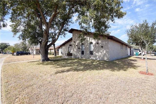 view of home's exterior with a yard