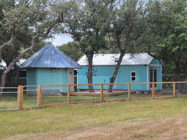 back of house with a lawn