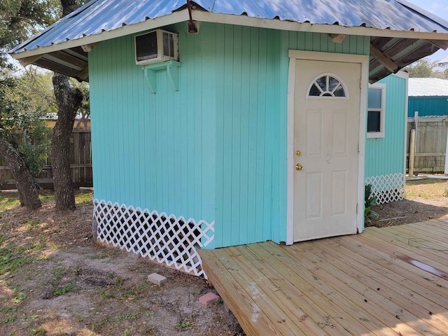 view of outbuilding with a wall mounted air conditioner