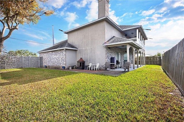 1725 Cliff Maus, Corpus Christi, TX 78416 - back of house featuring a patio area, a fenced backyard, a chimney, a balcony, and a shingled roof