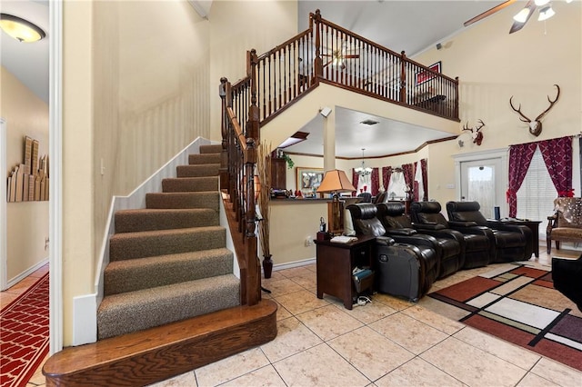 1725 Cliff Maus, Corpus Christi, TX 78416 - living area featuring ceiling fan, stairway, tile patterned floors, a towering ceiling, and ornamental molding