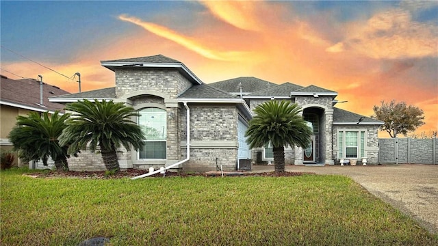 french provincial home with a lawn and central AC