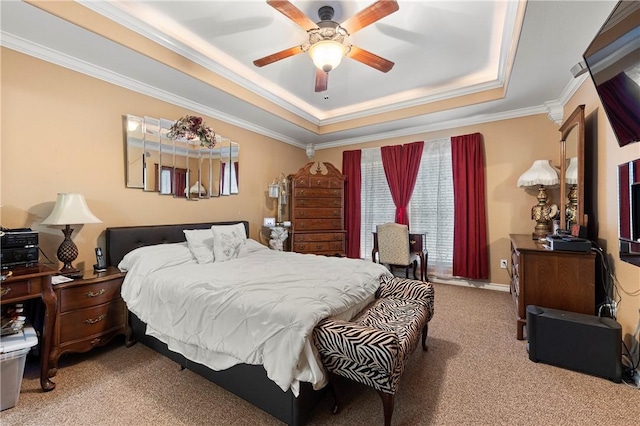 bedroom featuring carpet flooring, a raised ceiling, ceiling fan, and crown molding