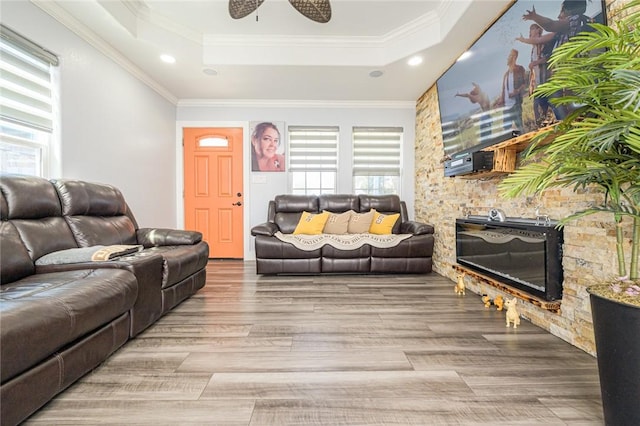 2774 Dallas Ave, Ingleside, TX 78362 - living room with a tray ceiling, ceiling fan, ornamental molding, wood finished floors, and recessed lighting