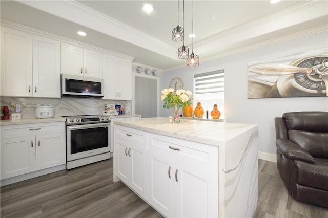 2774 Dallas Ave, Ingleside, TX 78362 - kitchen with white microwave, stainless steel electric range oven, dark wood-type flooring, tasteful backsplash, and white cabinets