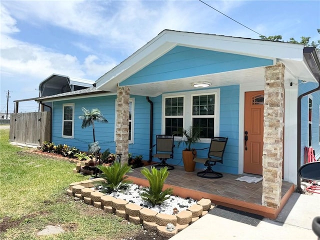 2774 Dallas Ave, Ingleside, TX 78362 - view of front of property featuring a porch and a front yard