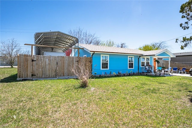 2774 Dallas Ave, Ingleside, TX 78362 - back of house featuring a carport