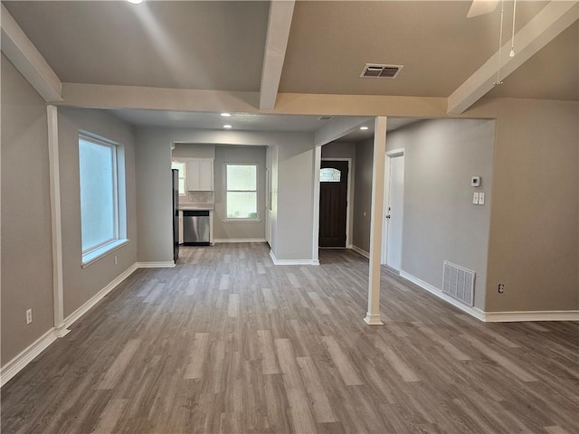 4134 Sierra St, Corpus Christi, TX 78410 - unfurnished living room with beamed ceiling, wood finished floors, and recessed lighting