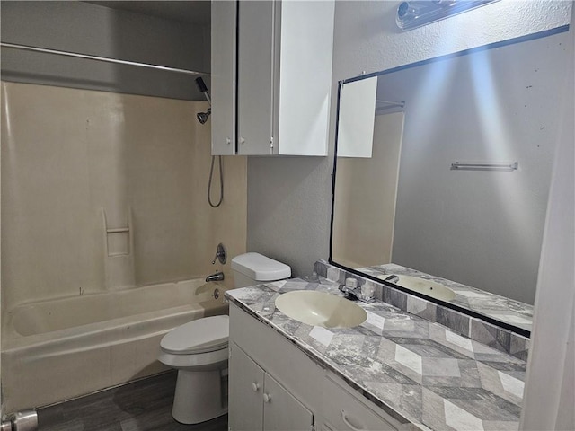 4134 Sierra St, Corpus Christi, TX 78410 - bathroom with vanity, shower / washtub combination, wood finished floors, and a textured wall