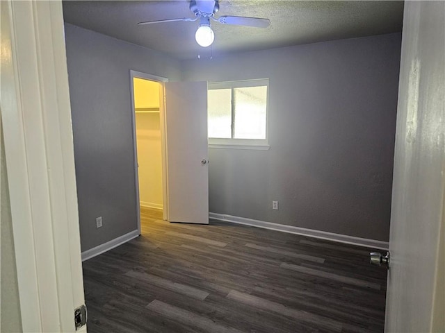 4134 Sierra St, Corpus Christi, TX 78410 - unfurnished bedroom with wood finished floors, ceiling fan, and a spacious closet